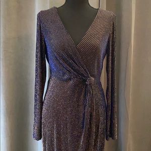 Formal black dress with blue and gold stitching.